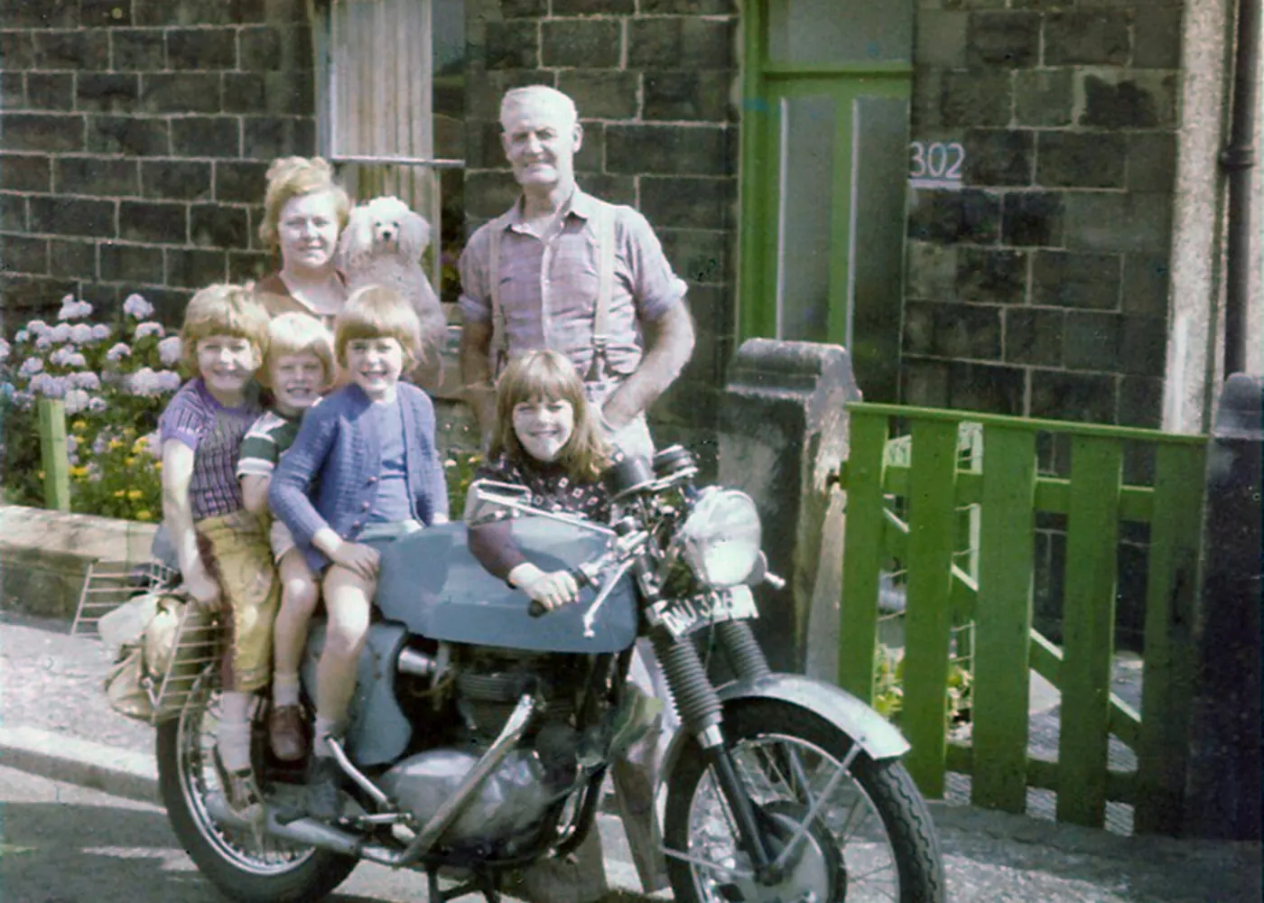 Family motorbike photograph after restoration, natural colour restored