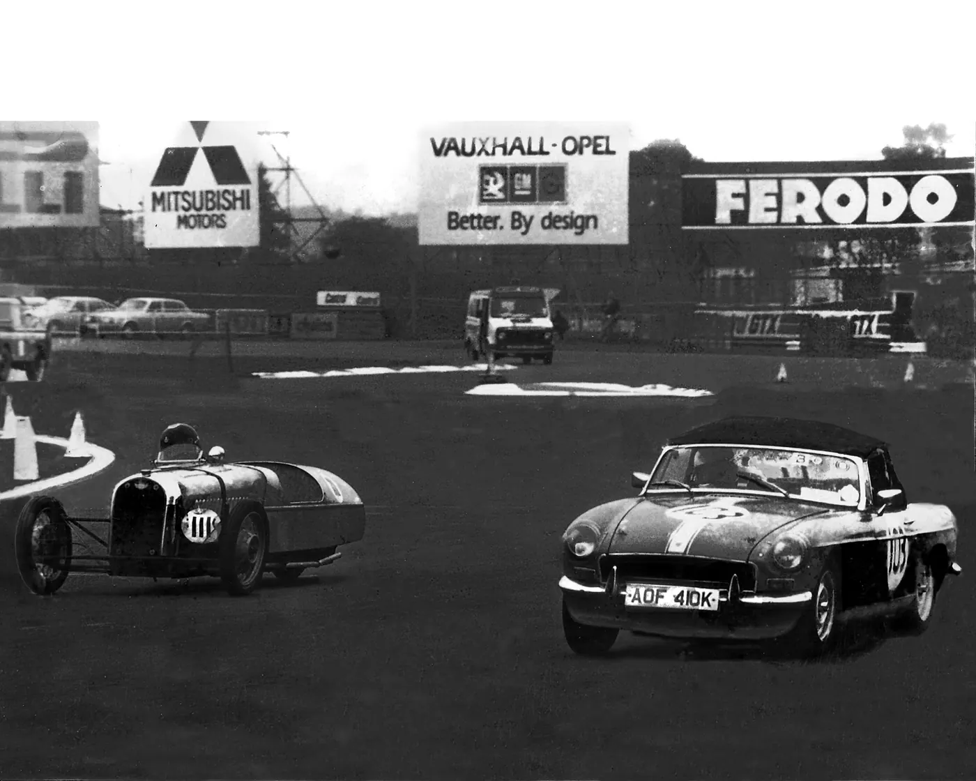 Vintage motor racing photograph before restoration
